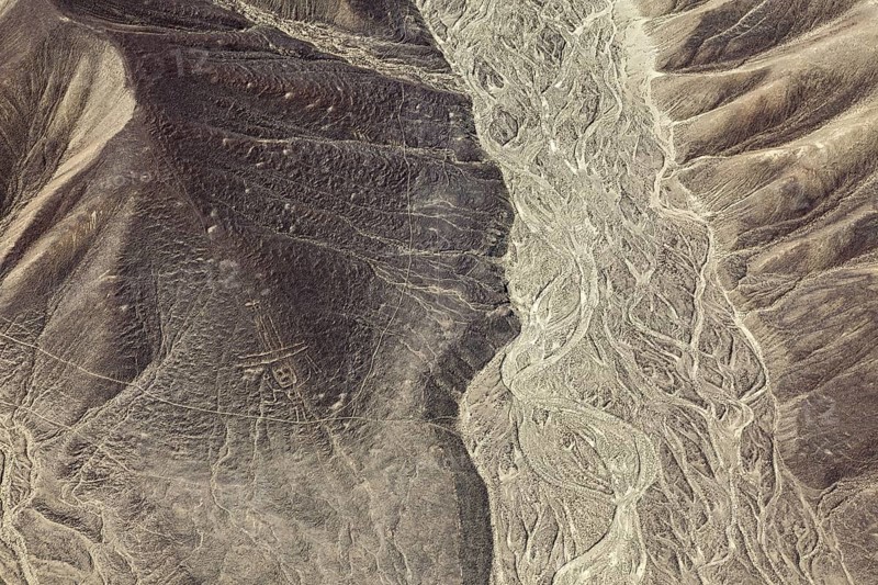 Hilly desert view with ancient lines and patterns, the geoglyphs and paintings in the desert near Nasca and Palpa in Peru