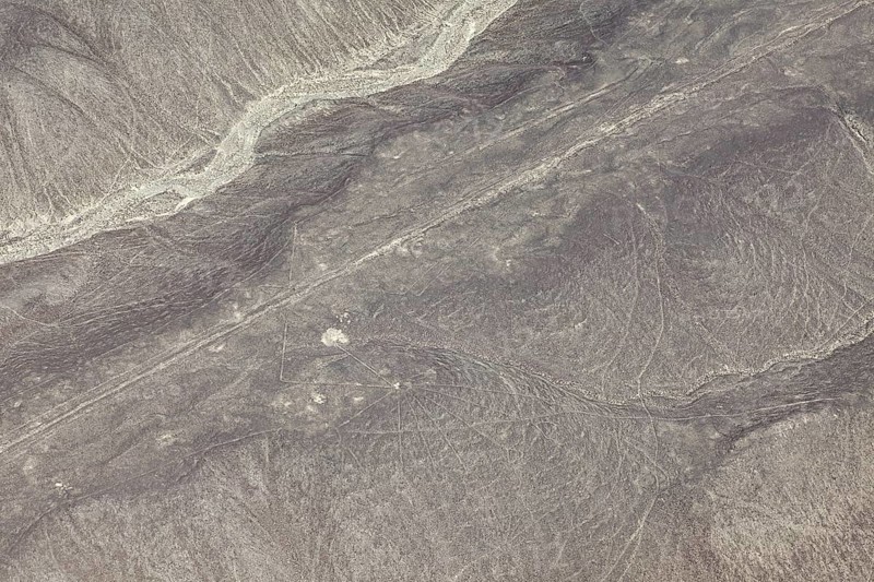 Dry, sandy landscape with distinctive lines and patterns, the geoglyphs and drawings in the desert near Nasca and Palpa in Peru