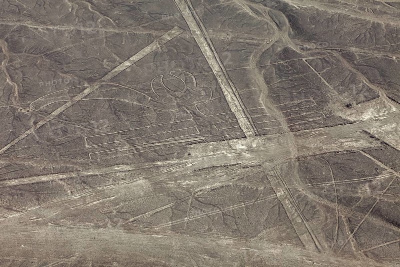 Aerial view of geoglyphs and lines that criss-cross the desert, the geoglyphs and images in the desert near Nasca and Palpa in Peru