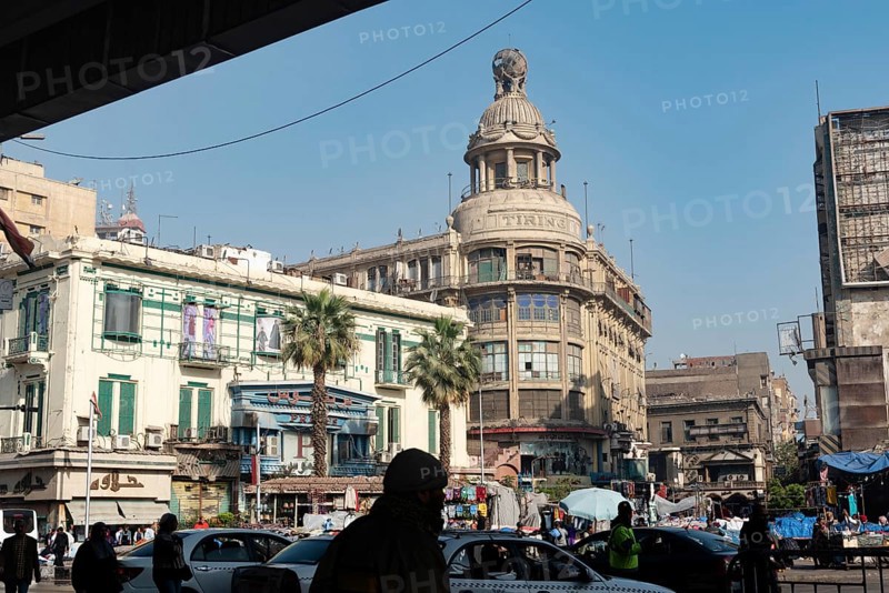 Cairo, Egypt. December 7th 2022 Busy Traffic crossing Attaba Square in front of the famous Tiring Building, an overcrowded district with a rich cultural heritage and history