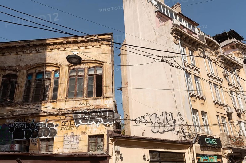 Bucharest, Romania. October 29th 2023. Graffiti covered crumbling architecture of the historical Old town of Bucharest, Romania