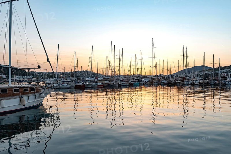Bodrum, Turkey. April 23rd 2022 Beautiful sunset yachts moored in Bodrum Harbor, Turkish Aegean coast of Turkey