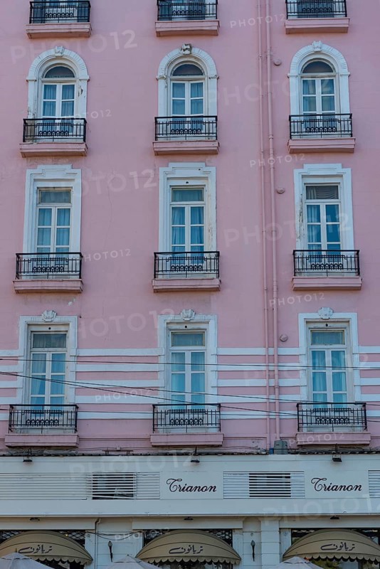 Alexandria, Egypt. December 4th 2022 The pink facade of Le Metropole Hotel and famous once Greek cafe and restaurant The Trianon, Saad Zagloul Square, near the Corniche, Alexandria, Egypt