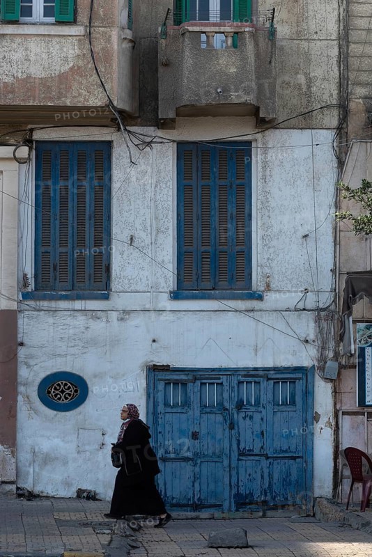 Alexandria, Egypt. December 3rd 2022. Blue painted doors and windows of faded traditional architecture along the Corniche of the north Egyptian Delta city of Alexandria, Egypt