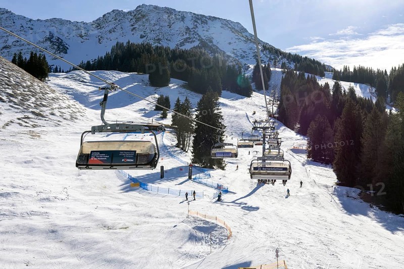 Sun and good snow conditions in the Oberjoch ski area in the Allgäu region. View of the slopes from the chairlift
