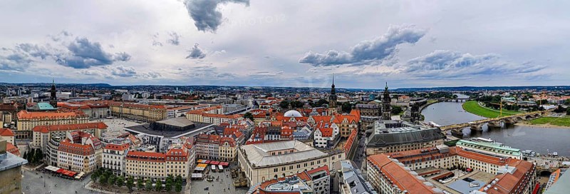 Bird's eye view of Dresden with red roofs and Elbe, under a cloudy sky, Dresden