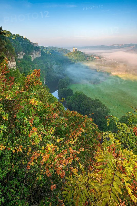 View of the ruins of Saaleck and Rudelsburg castles and the river Saale in autumn morning fog in the Saale Valley, Bad Kösen, Burgenlandkreis, Saxony-Anhalt, Germany