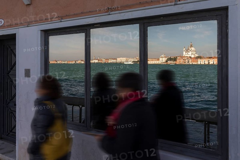 Santa Maria della Salute is reflected in a shop window on the island of Giudecca, Venice, Veneto, Italy