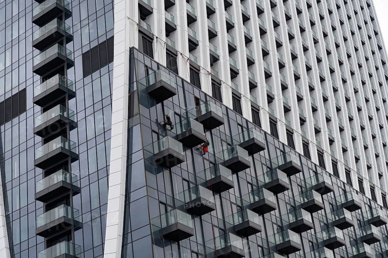 Batumi, Georgia. July 21st 2025. Window cleaning of the modern high-rise Marriott hotel on the seafront at Batumi on the Black Sea coast of Georgia