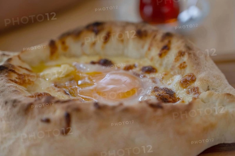 Acharuli-Ajarian Khachapuri, the most popular street food in Georgia, a famous breakfast dish made of a boat shaped baked bread, cheese and egg
