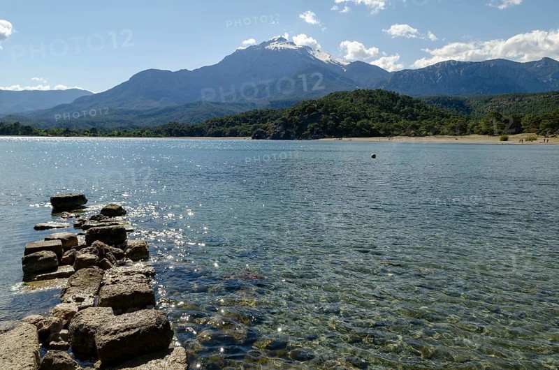 The crystal clear waters of the Mediterranean at the ancient harbour of Phaselis, Kemer, Antalya, Turkey