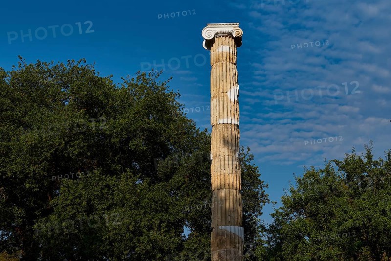 Victory Column of Nike, Single Stone Column with Capital against a Blue, Cloudy Sky, Archaeological Site, Ancient Olympia, Olympia, Peloponnese, Greece