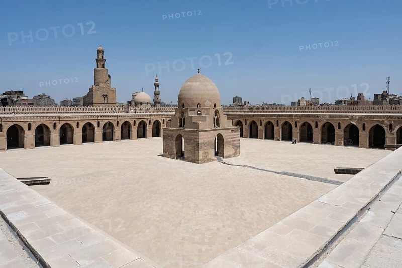 The magnificent architecture of the courtyard, dome and minarets of Ibn Tulun Mosque in Islamic Cairo, one of the oldest mosques in Egypt