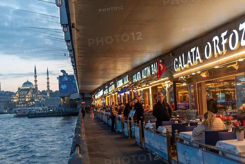 Istanbul, Turkey. January 3rd 2025 Fish restaurants at night on the the iconic Galata Bridge at the entrance to the Golden Horn and Bosporus Straight, Istanbul, Turkey