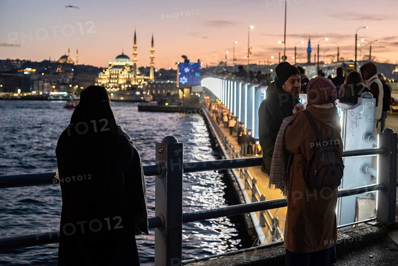 Istanbul, Turkey. January 3rd 2025. Tourists and locals gather at sunset on the iconic Galata Bridge at the confluence of the Bosporus and Golden Horn on the European side of Istanbul, Turkey