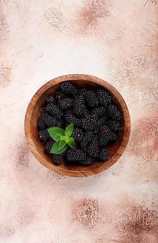 Blackberries, in a wooden bowl, top view, no people