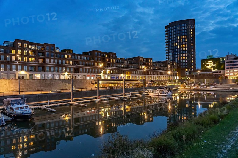 Maasboulevard and city harbor in Venlo at dusk, the Netherlands