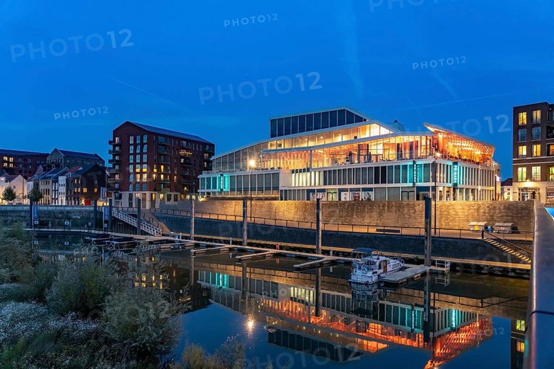 Primark on Maasboulevard and city harbor in Venlo at dusk, the Netherlands