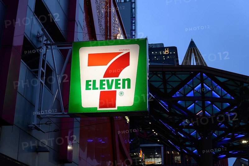 7 Eleven shop front sign and logo outside the popular convenience shop and supermarket in central Bangkok, Thailand