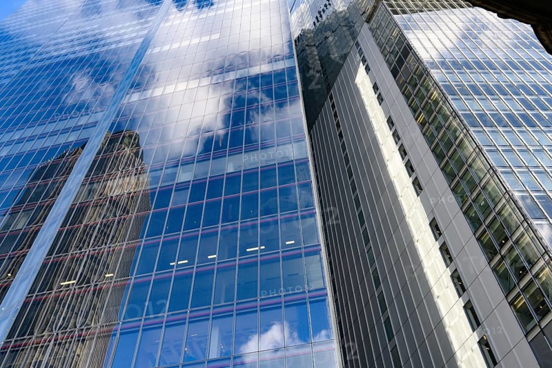 Modern abstract reflections in glass fronted commercial office buildings in the financial district of the British capital London