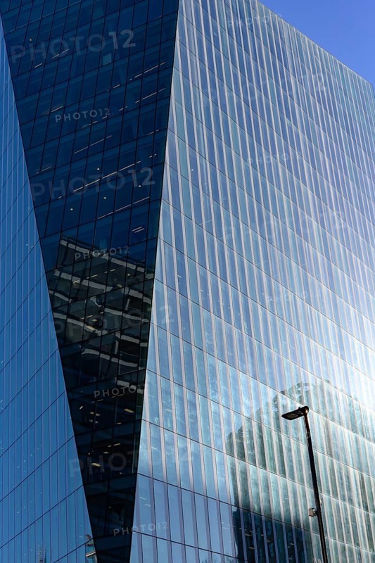 Close-Up architectural detail of a modern glass fronted office building in the city of London, economic and financial centre of the United Kingdom