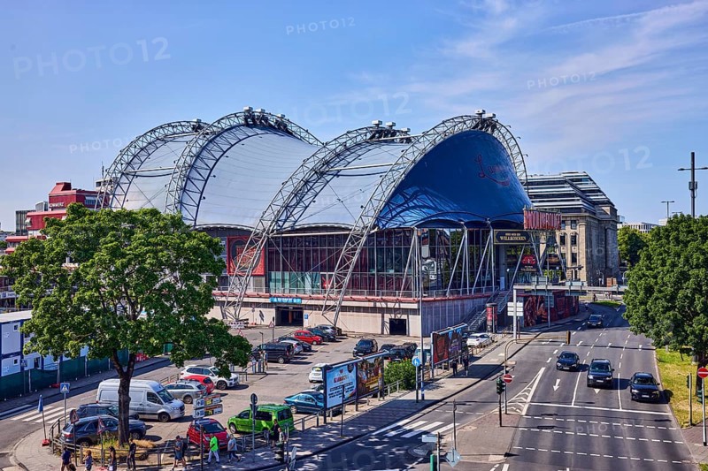 Musical Dome, large tent, road, general architecture, road markings lanes and stop line, cars, parking lot, lawn, trees, bird's eye view, blue sky, cirrus clouds, federal road B51, Konrad-Adenauer-Ufer, Cologne, district-free city, North Rhine-Westphalia, Germany