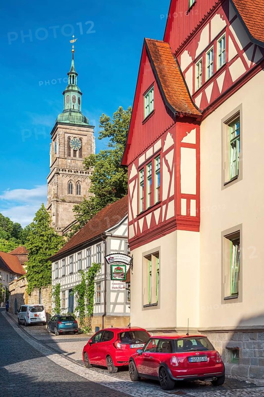 Street with half-timbered houses and cobblestones at the Gothic St. Mary's Church, Königsberg in Bavaria, Lower Franconia, Bavaria, Germany
