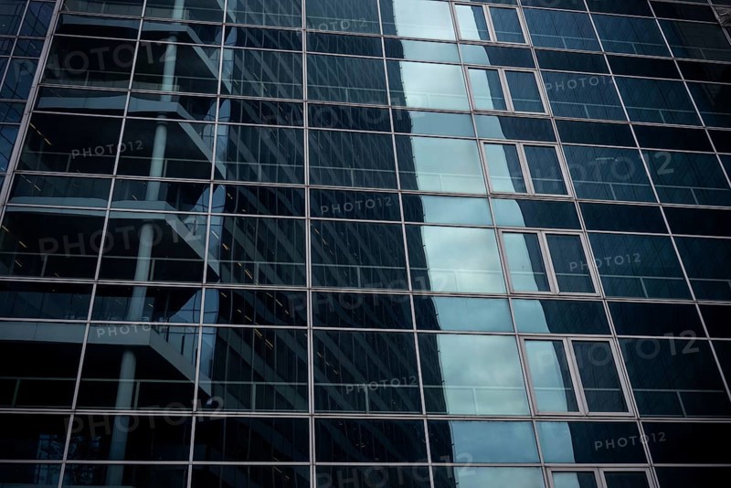 Abstract architecture of a glass fronted office building in a Paris commercial and financial centre, France