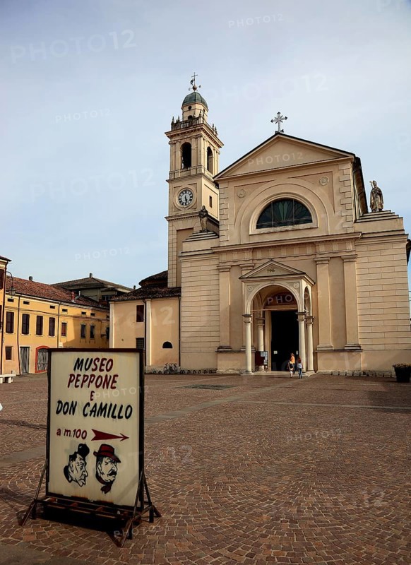 Brescello, note about the Don Camillo and Peppone museum in front of the church of Santa Maria Nascente e San Genesio, a filming location for the films, Emilia-Romagna, Italy