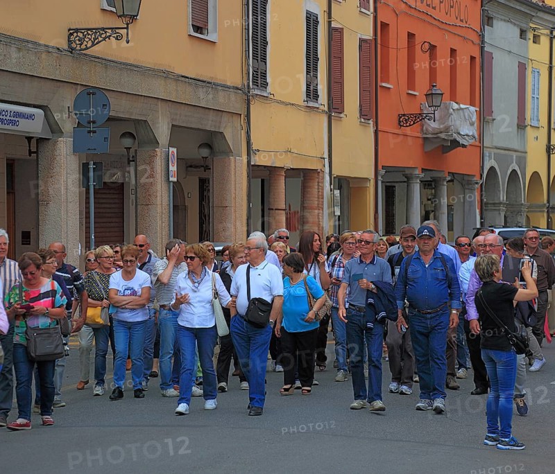 Group of visitors in the town of Don Camillo and Peppone, Brescello, Emilia-Romagna, Italy