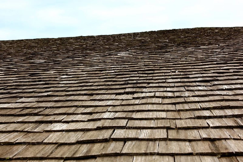 Close-up of a traditional wooden shingle roof, building materials, wood shingles