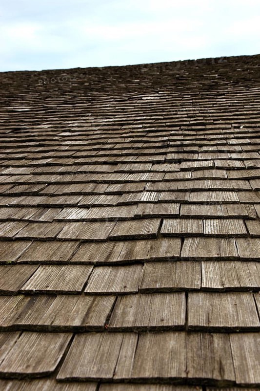 Close-up of a traditional wooden shingle roof, building materials, wood shingles