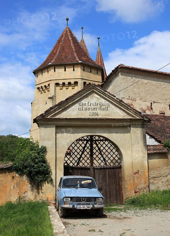 The fortified church of Seica Mica, German Kleinschelken, in front of it a Daccia 1300, a community in Sibiu district in Transylvania, Romania