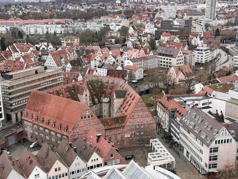 Panoramic view of a city with characteristic red roofs and modern buildings, view from Ulm Minster, Ulm