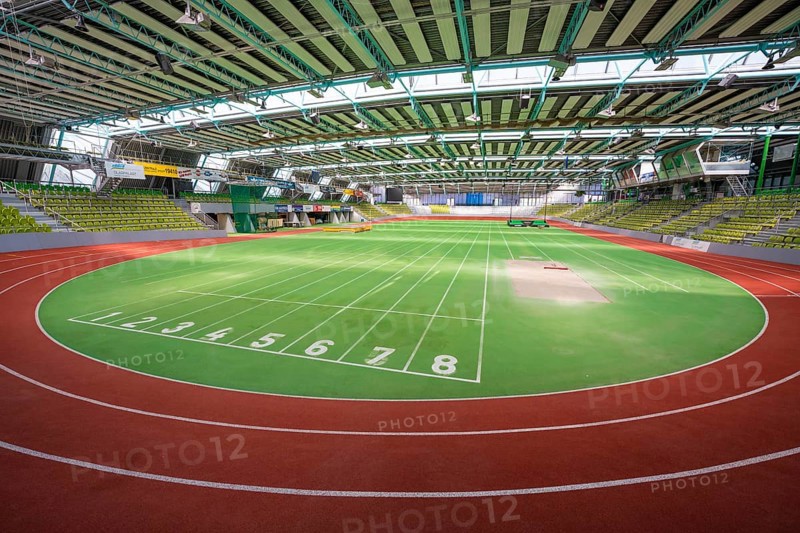 Round green running track with numbered markings in a sports hall, Glaspalast Sindelfingen, Böblingen district, Germany