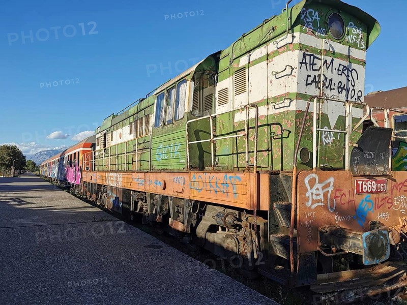 Old locomotive with graffiti on an abandoned train station, Albania