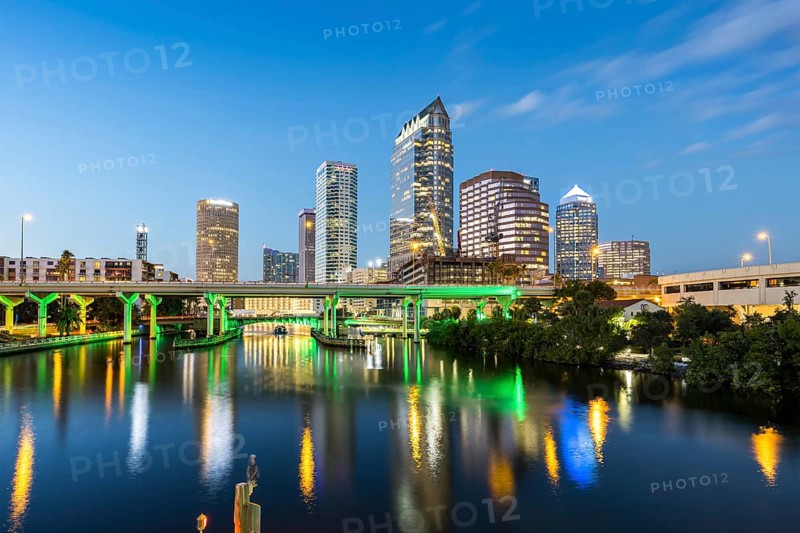 Tampa skyline with skyscrapers and bridge over Hillsborough River at night in downtown Tampa, USA