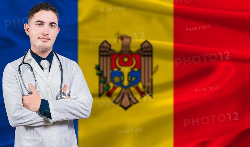 Portrait of medical professional on Moldova flag background. Moldovan national health system