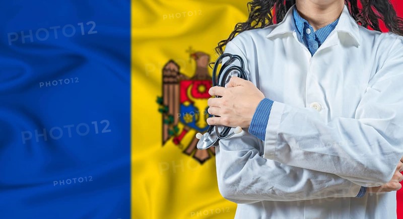 Healthcare professional with Moldova flag background. Professional doctor holding stethoscope on Moldova flag background
