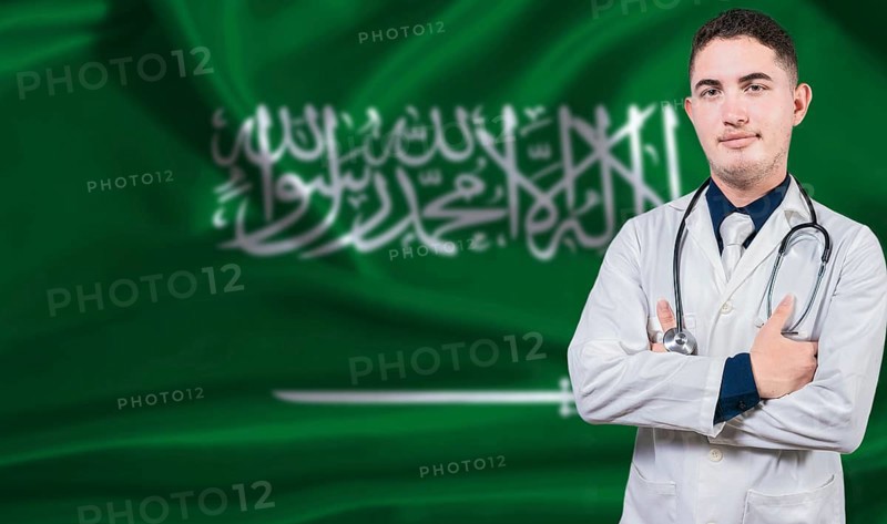 Portrait of medical professional on Saudi Arabia flag background. Saudi national health system