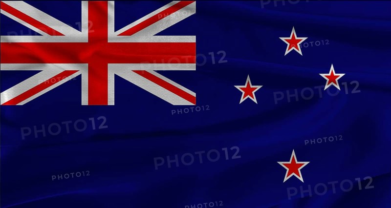 Flag of New Zealand with fabric textured background. Close up of National flag of New Zealand with realistic texture