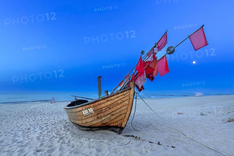 Traditional wooden fishing boat on the beach along the Baltic Sea at Stubbenfelde, Loddin on the island Usedom, Mecklenburg–Western Pomerania, Germany