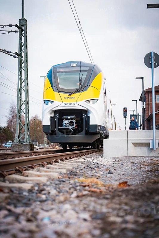 Modern locomotive at close range on railway tracks under grey skies, opening of the Hermann Hesse Railway, Calw, Germany