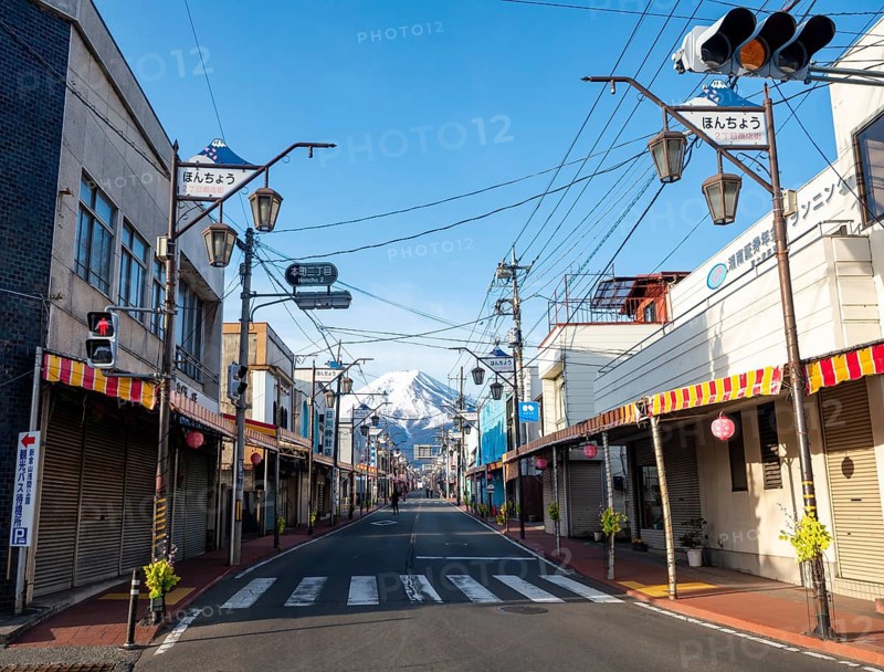 Road through the Japanese town of Fujiyoshida, behind the volcano Mt. Fuji, Yamanashi Prefecture, Japan