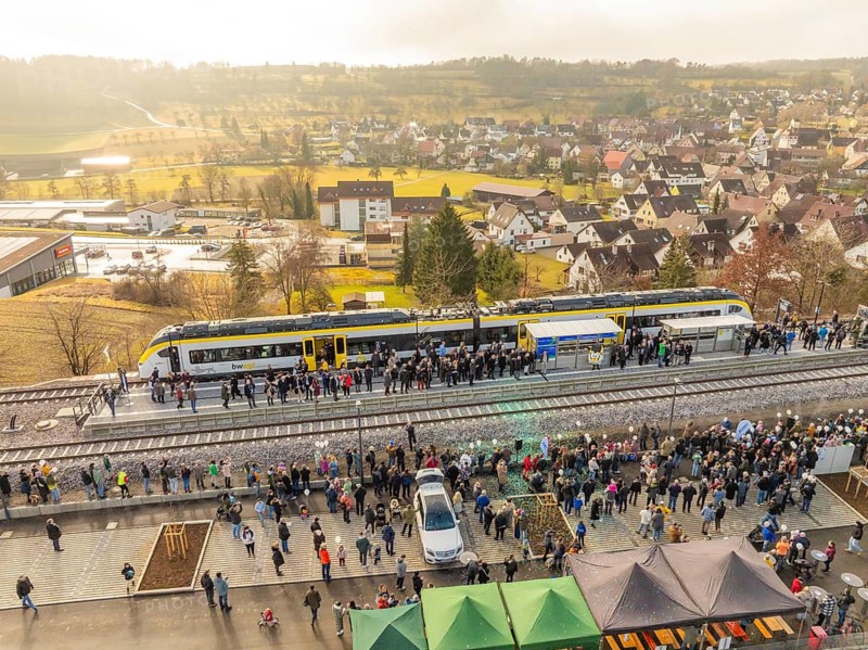 Numerous people at a village train station, festive atmosphere upon arrival by train, opening of the Hermann Hesse Railway, Calw, Germany
