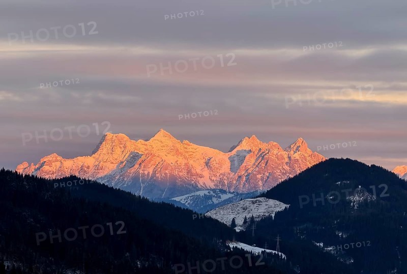 Alpine glow at sunset, mountain peaks of the Loferer Steinberge in winter, Kitzbühel Alps, Tyrol, Austria