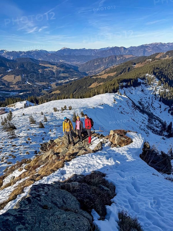 Three friends hiking trail to the summit of Feldalphorn, winter hiking, Kitzbühel Alps, Tyrol, Austria