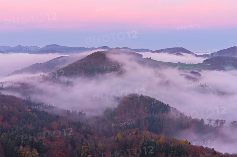 View from the Gisliflue of the Jurassic foothills covered in fog from the left, Wasserfluh, Summerholde, Asperstrihen, in the light of the rising sun, Talheim, Canton of Aargau, Switzerland