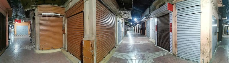 Medina, during Ramadan, darkened market alleys with closed shutters in an urban night atmosphere, Morocco