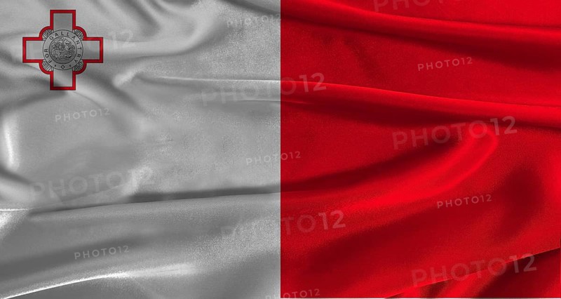 Flag of Malta with fabric textured background. Close up of National flag of Malta with realistic texture